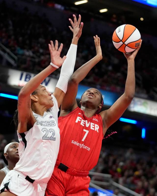 Indiana Fever's Aliyah Boston (7) shoots over Las Vegas Aces' A'ja Wilson (22) during the first ...