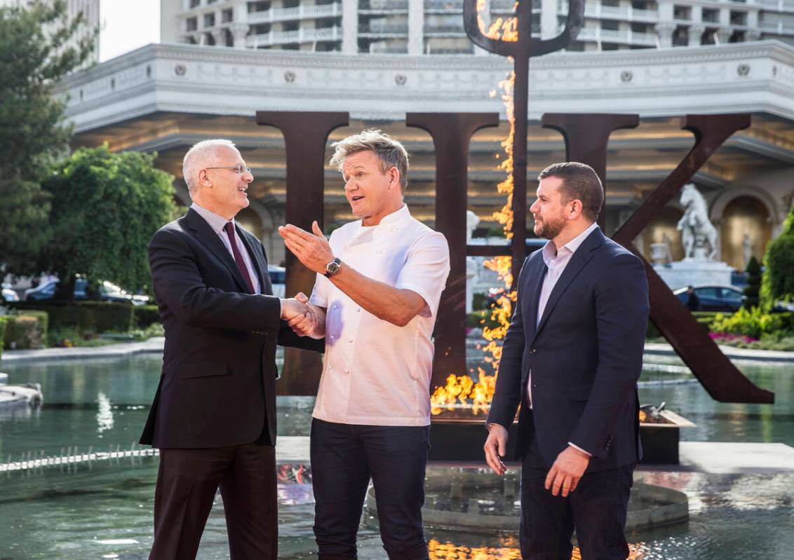 Caesars Palace president Gary Selesner, left, shakes hands with celebrity chef Gordon Ramsey an ...