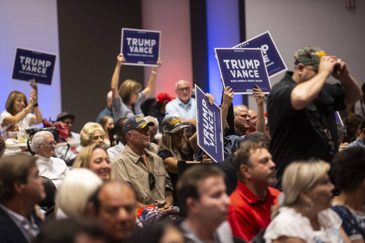 Supporters at a watch party cheer for Republican presidential nominee former President Donald T ...