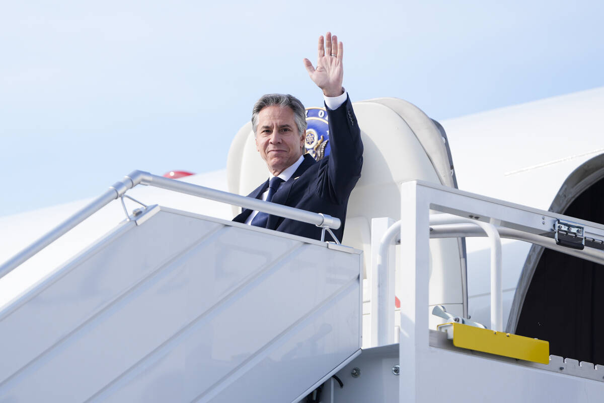 U.S. Secretary of State, Antony Blinken waves as he arrives at Chopin Airport in Warsaw, Poland ...