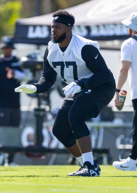 Raiders offensive tackle Thayer Munford Jr. (77) begins to warm up during the second day of Rai ...