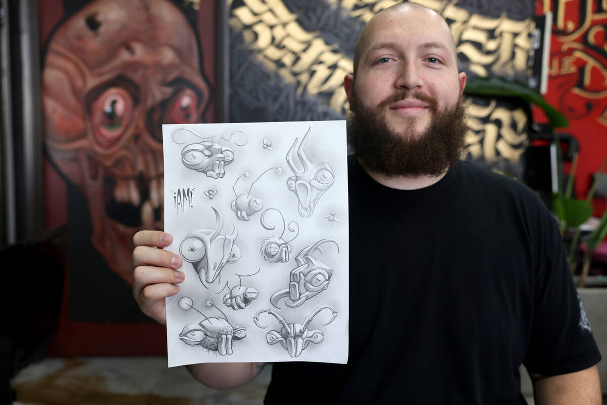 Beneath the Surface Tattoo tattoo artist Jacob Johnson shows some of his flash available for th ...