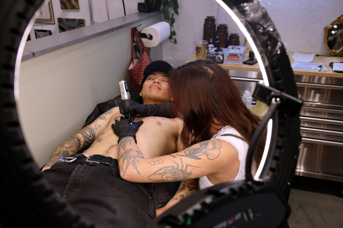 Olivia Morelli tattoos a client at 18B Tattoo on South Commerce Street in downtown Las Vegas Th ...