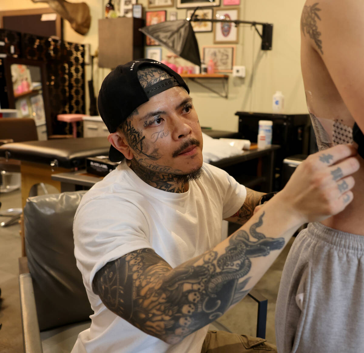 Michael Ta prepares a tattoo for a client at 18B Tattoo on South Commerce Street in downtown La ...