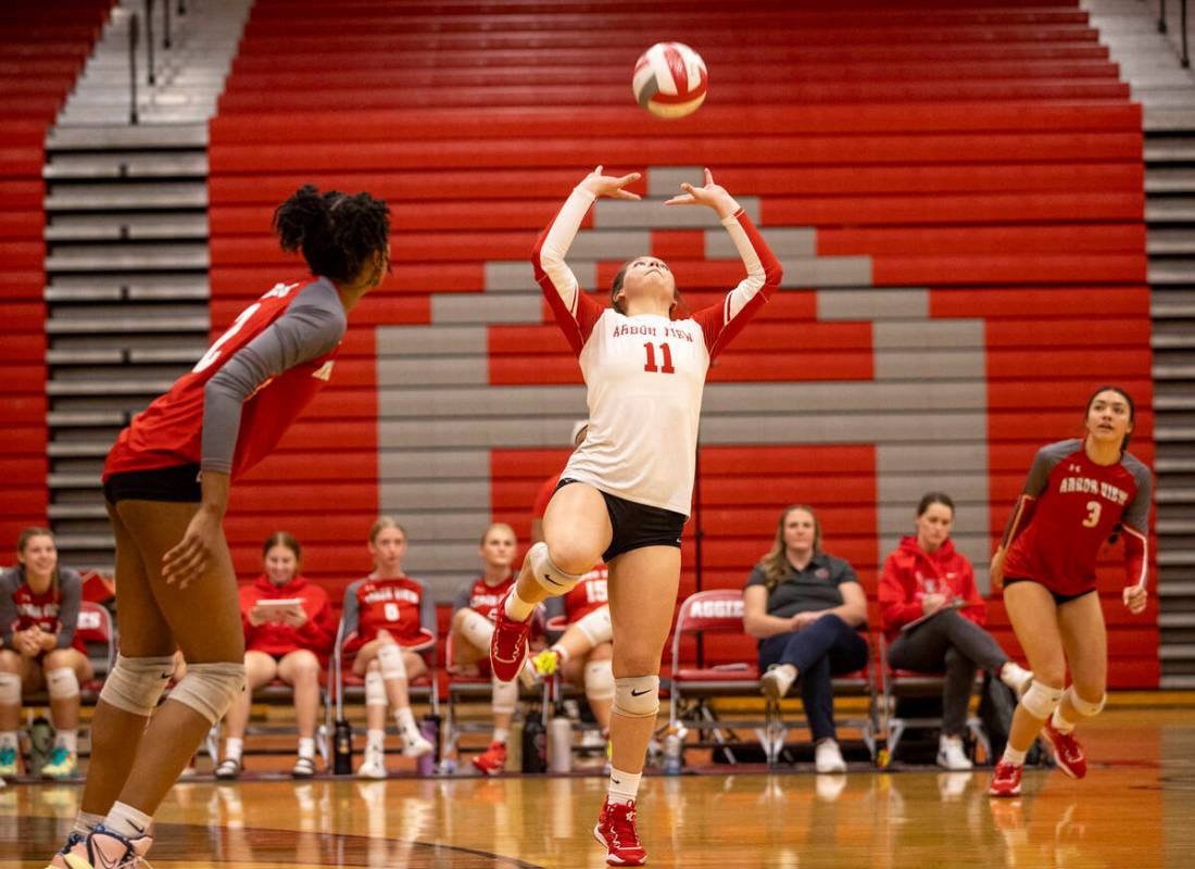 Arbor View junior Lauryn Brenner (11) sets the ball during the high school volleyball game agai ...