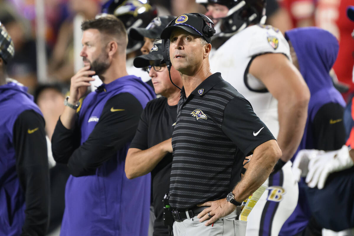 Baltimore Ravens head coach John Harbaugh looks to the clock near the end of the first half an ...