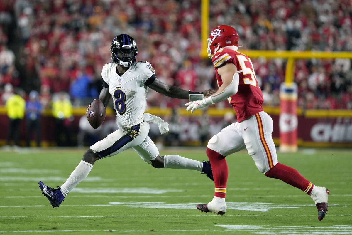 Baltimore Ravens quarterback Lamar Jackson (8) scrambles as Kansas City Chiefs linebacker Leo C ...