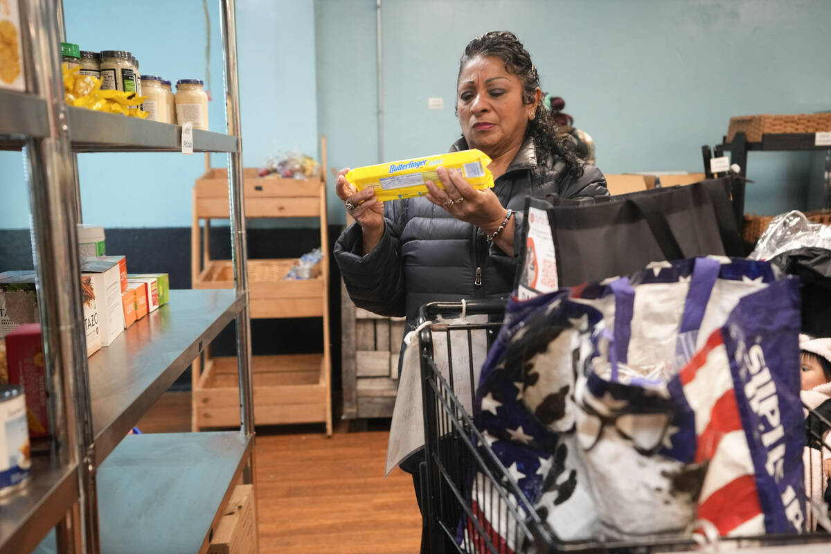 Betsy Quiroa shops at a market-style food pantry at the Carver Center in Port Chester, N.Y., We ...