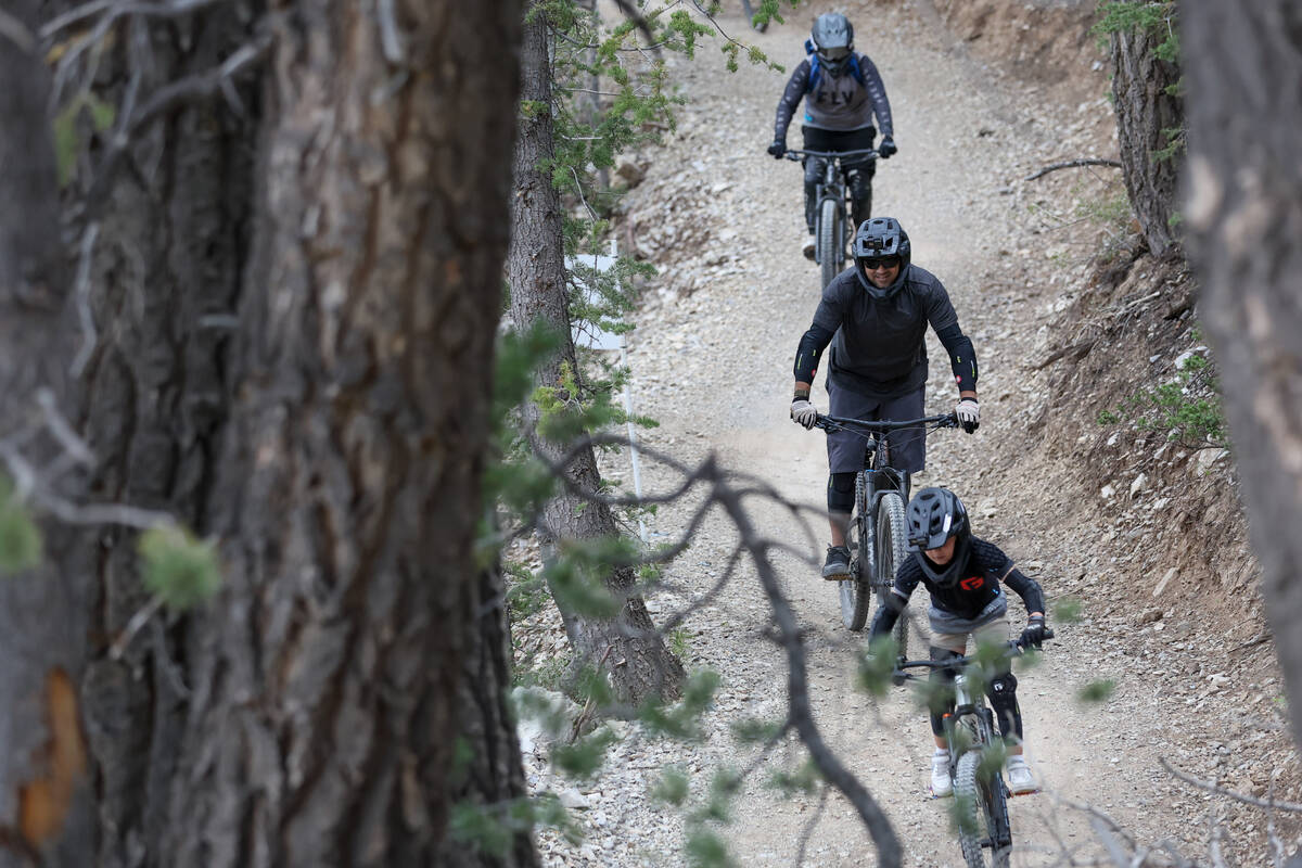 A family of mountain bikers navigate the trails at Lee Canyon on Saturday, Sept. 7, 2024, at Mo ...