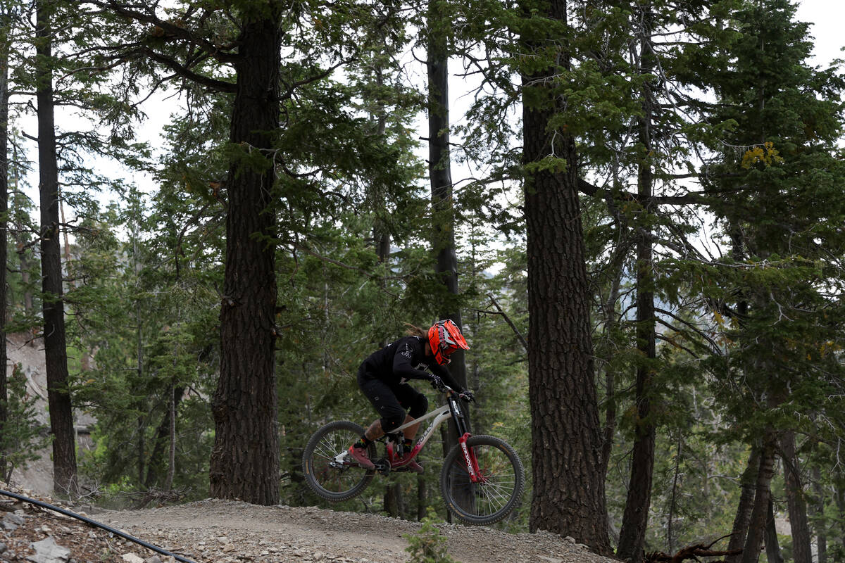 A mountain biker hits a jump on the course at Lee Canyon on Saturday, Sept. 7, 2024, at Mount C ...