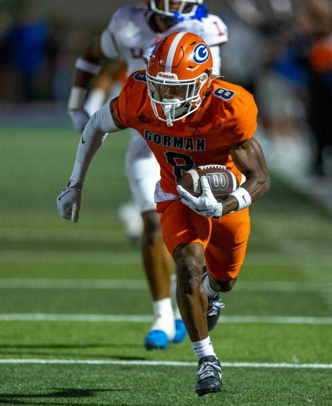 Bishop Gorman wide receiver Greg Toler (8) runs to the end zone after a long touchdown pass ove ...