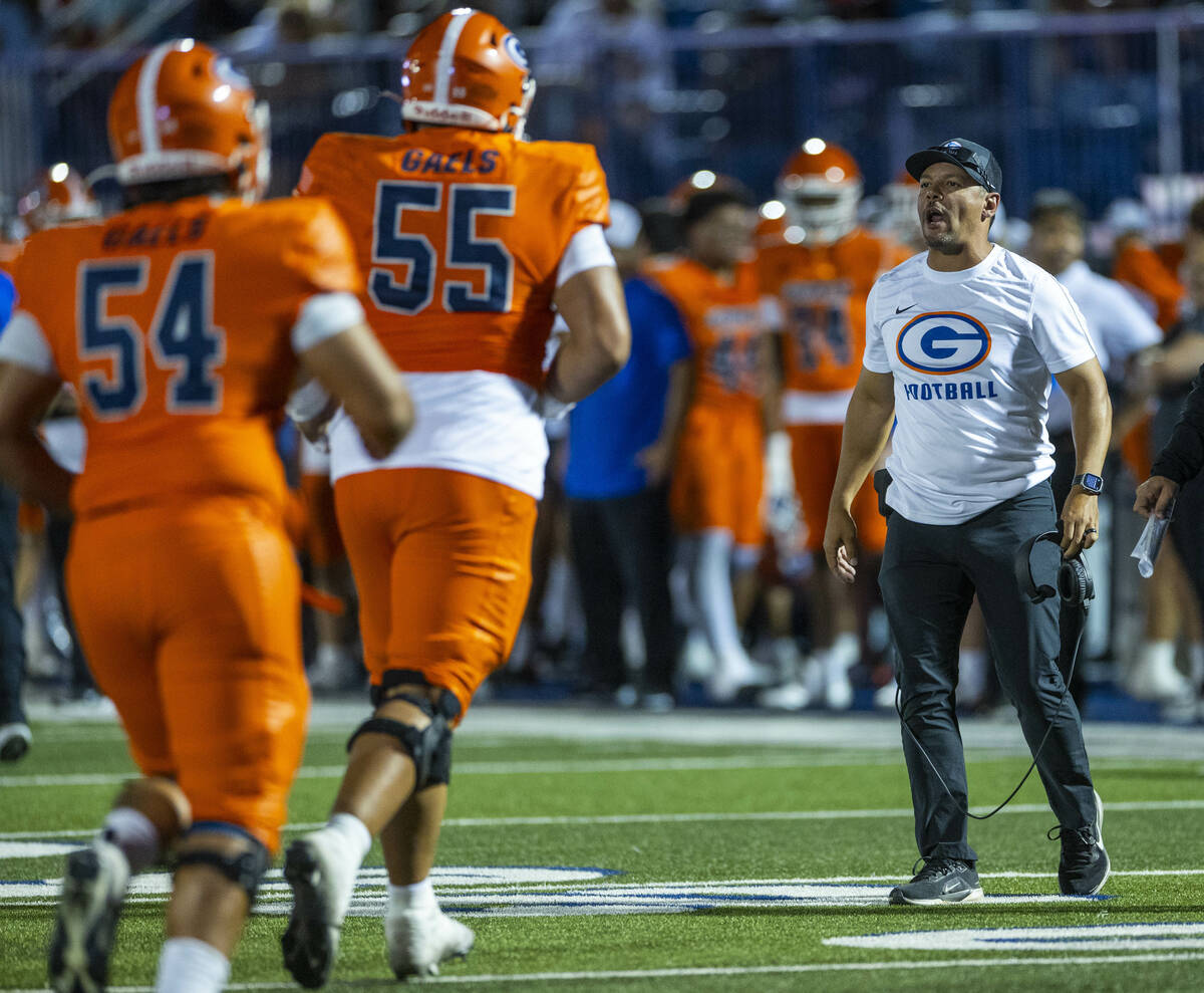 Bishop Gorman head coach Brent Browner yells instructions to his players after a score against ...