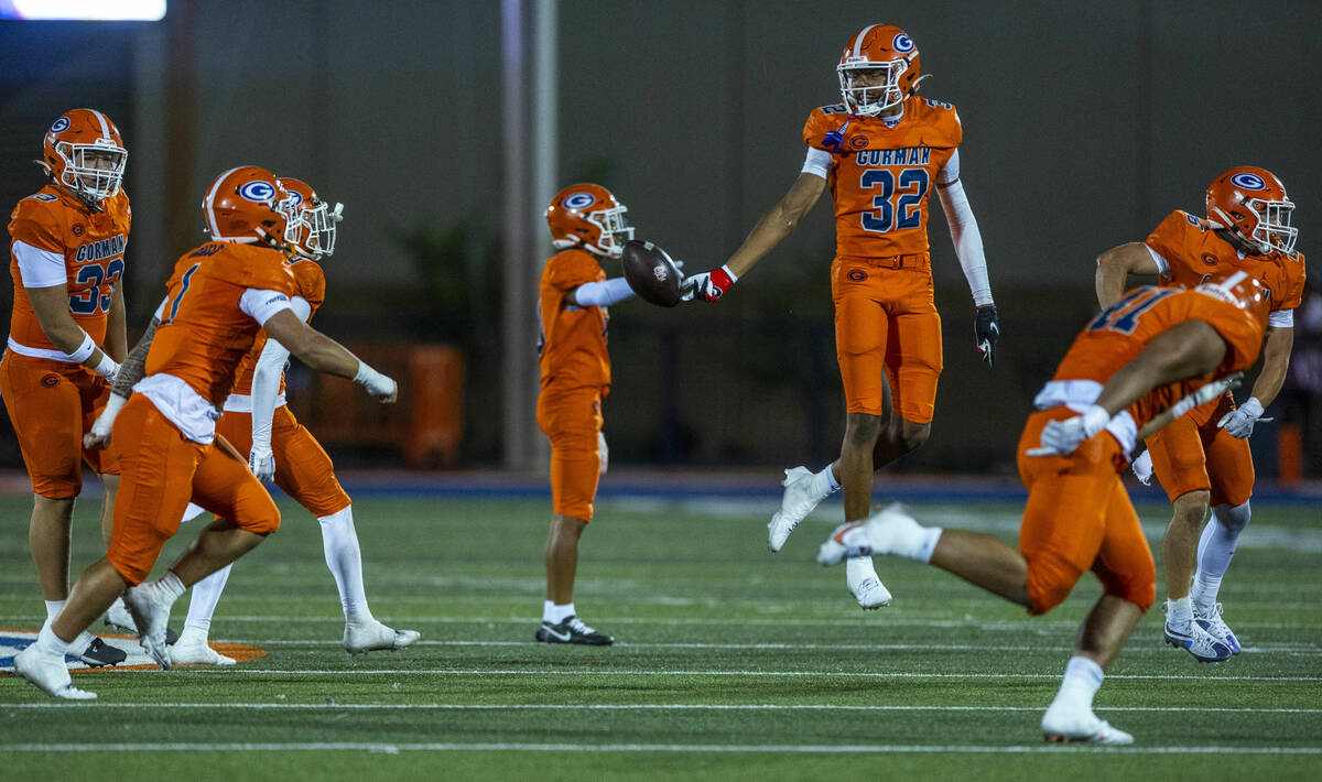 Bishop Gorman cornerback Hayden Stepp (32) celebrtaes a fumble recovery by Orange Lutheran quar ...