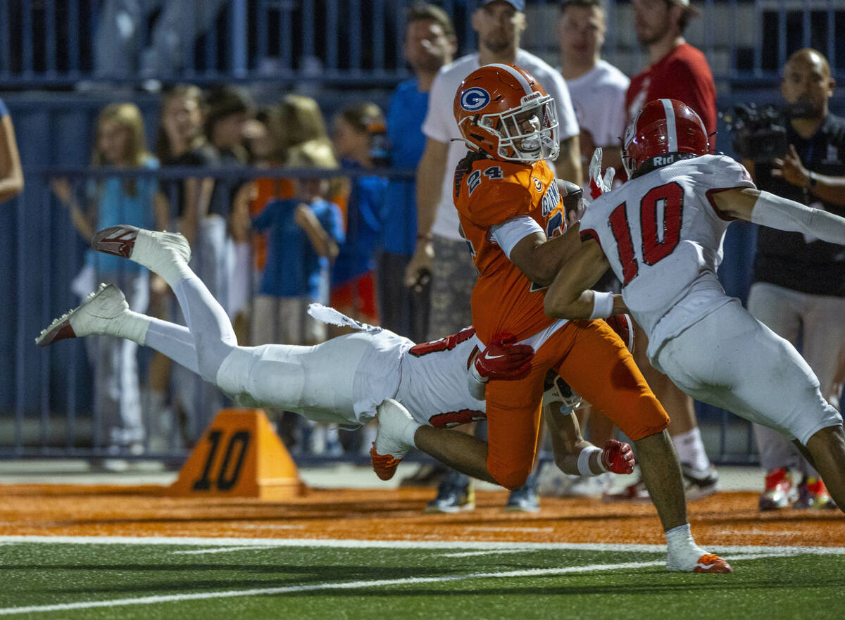 Bishop Gorman running back Myles Norman (24) is caught near the end zone after a long run by Or ...