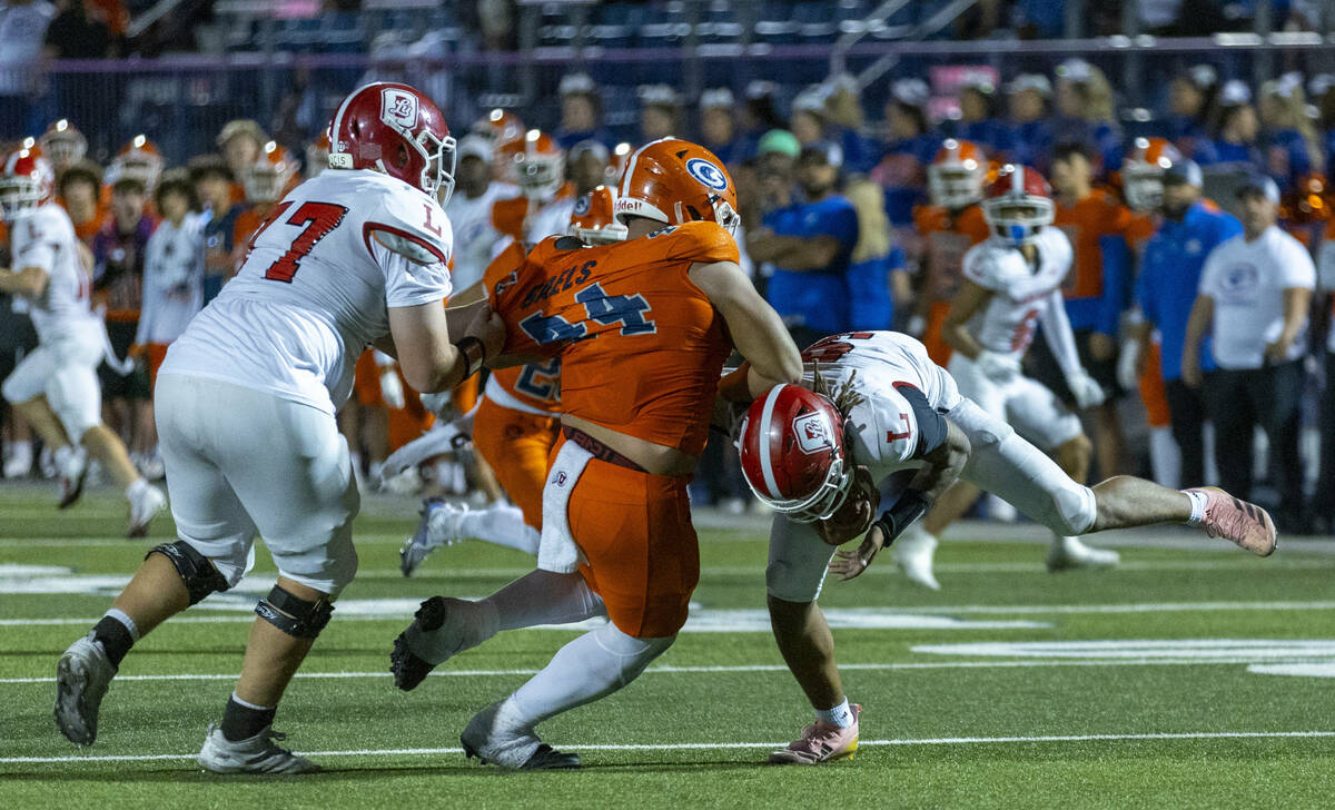 Bishop Gorman defensive lineman Sione Motuapuaka (44) sacks Orange Lutheran quarterback Tj Late ...