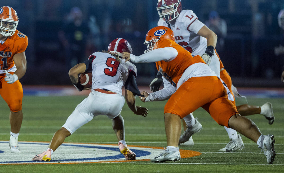 Bishop Gorman defensive lineman Caleb Joy (90) sacks Orange Lutheran quarterback Tj Lateef (9) ...