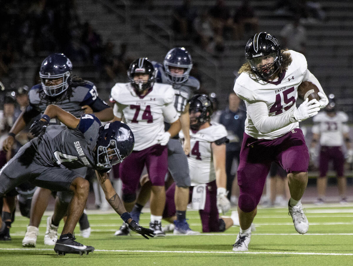 Faith Lutheran senior Maddox Valoaga (45) runs the ball during the high school football game ag ...