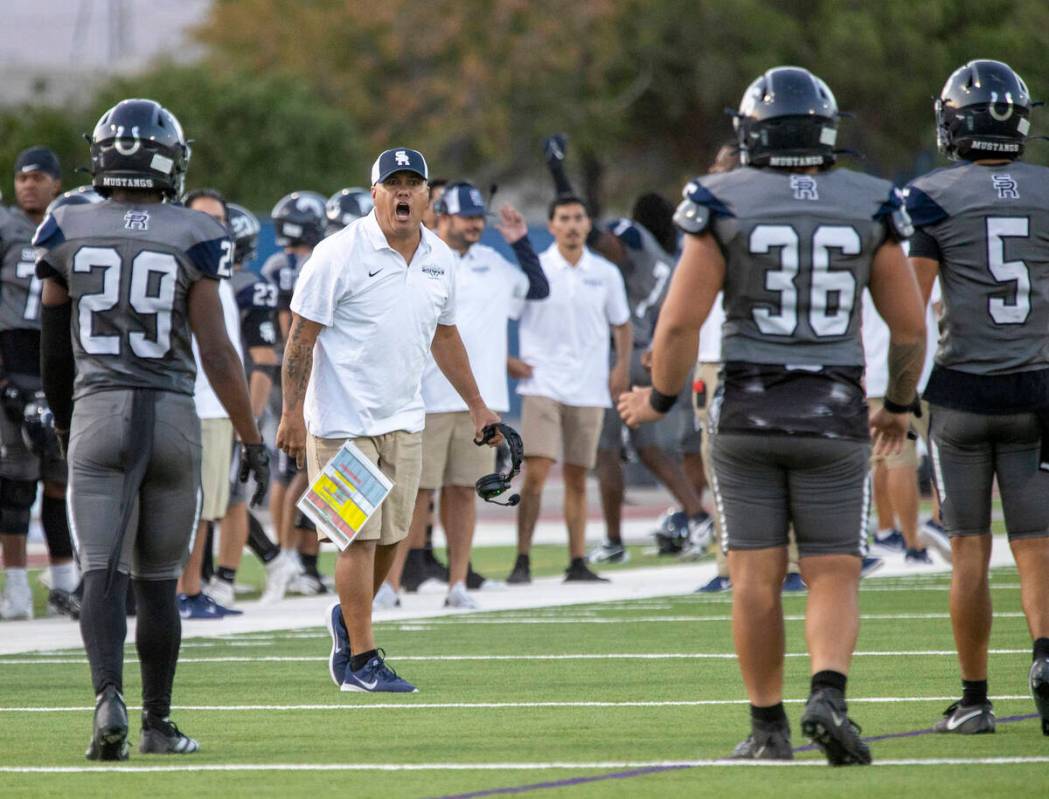 Shadow Ridge Head Coach Travis Foster yells at his players during the high school football game ...