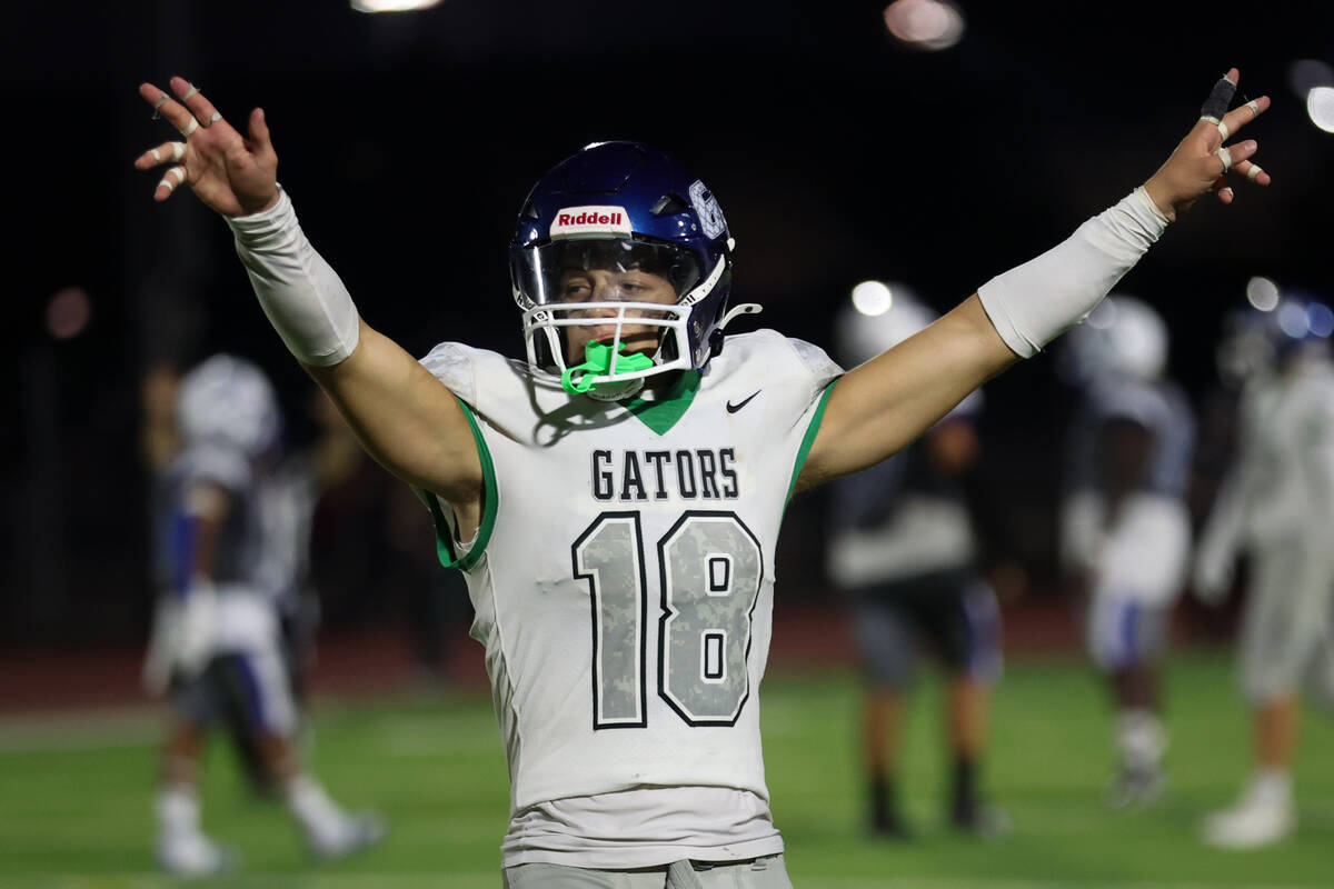 Green Valley’s Roman Adams (18) celebrates during the second half of a high school footb ...