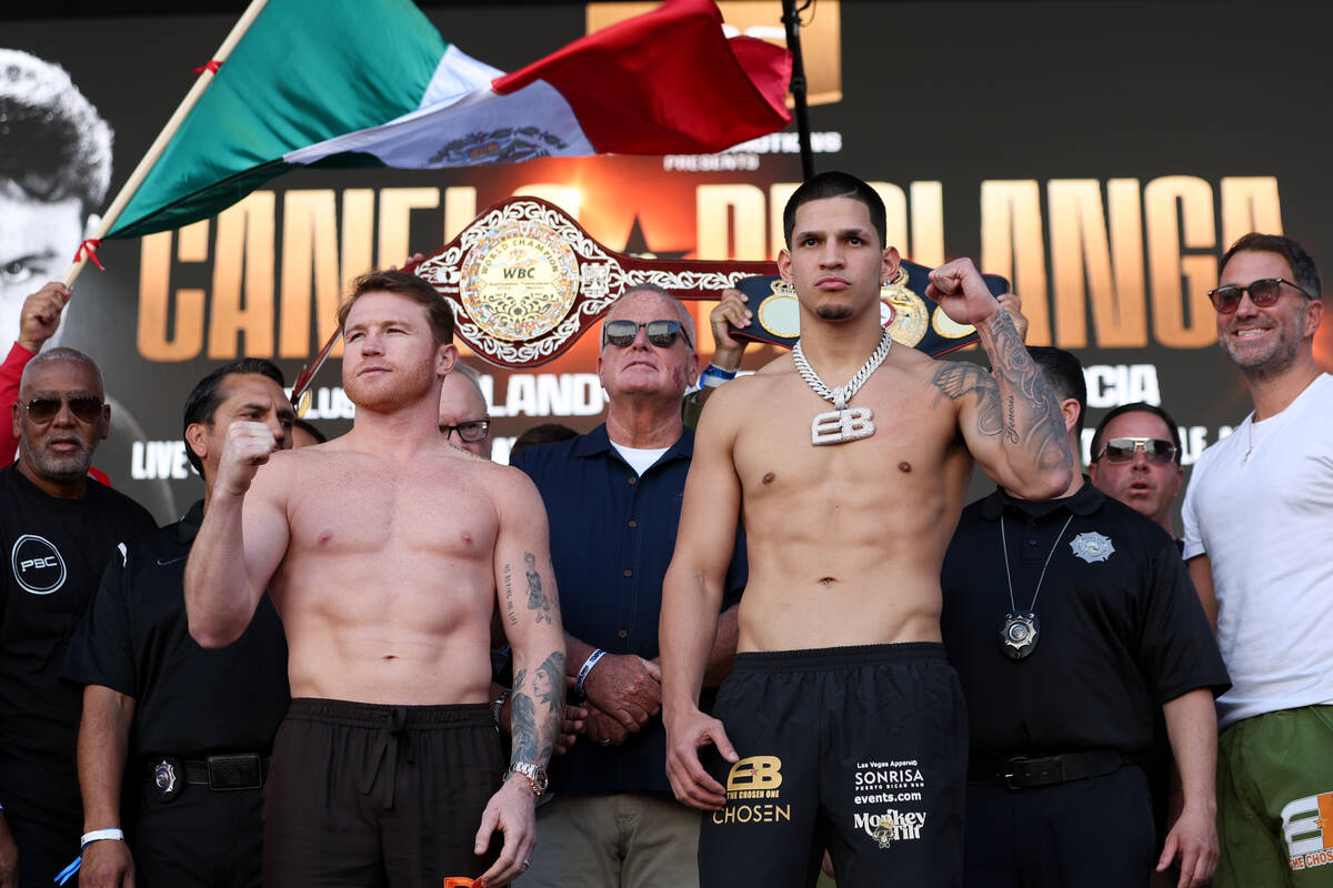 Canelo Alvarez, left, and Edgar Berlanga, right, weigh in ahead of their super middleweight tit ...