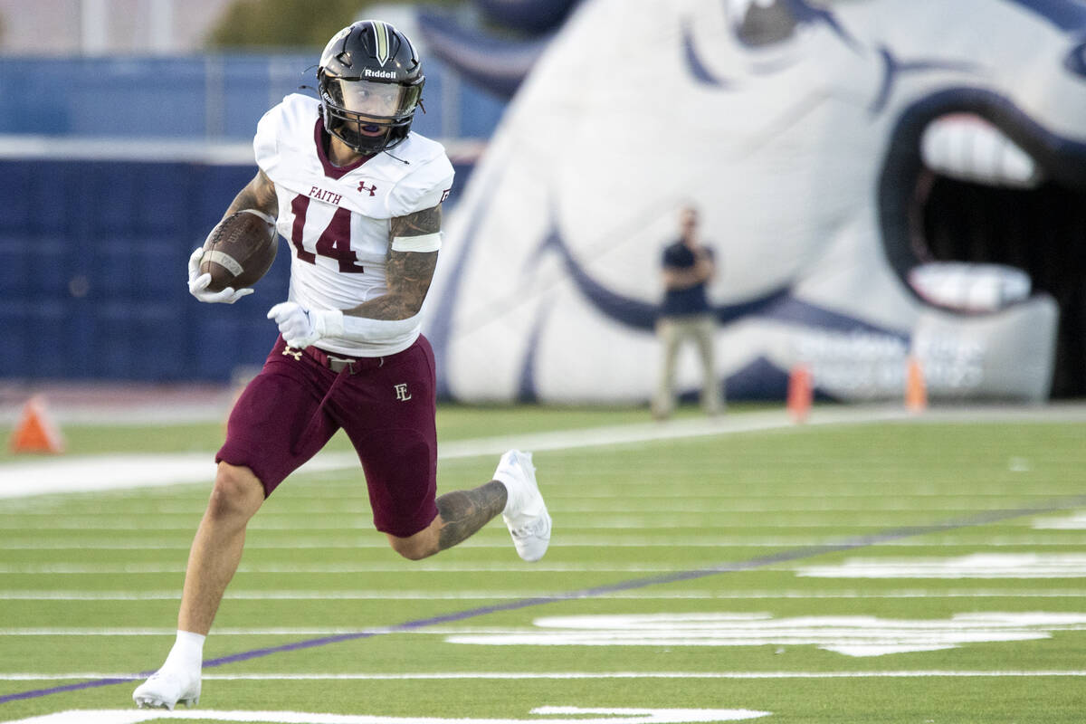 Faith Lutheran senior Cale Breslin (14) competes during the high school football game against S ...