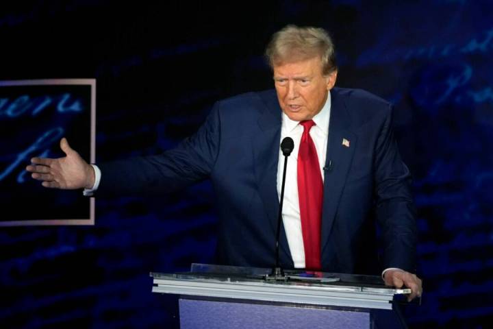 Former President Donald Trump speaks during a presidential debate with Democratic presidential ...