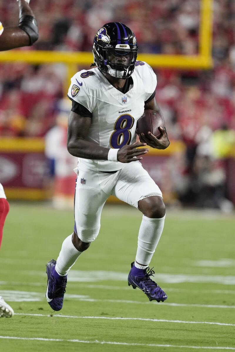 Baltimore Ravens quarterback Lamar Jackson (8) runs against the Kansas City Chiefs during an NF ...