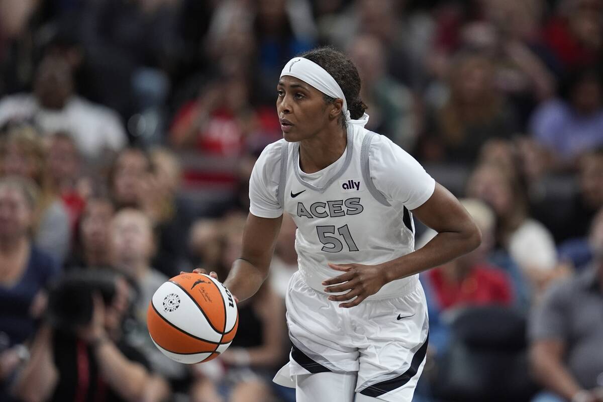 Las Vegas Aces' Sydney Colson dribbles during the second half of a WNBA basketball game against ...