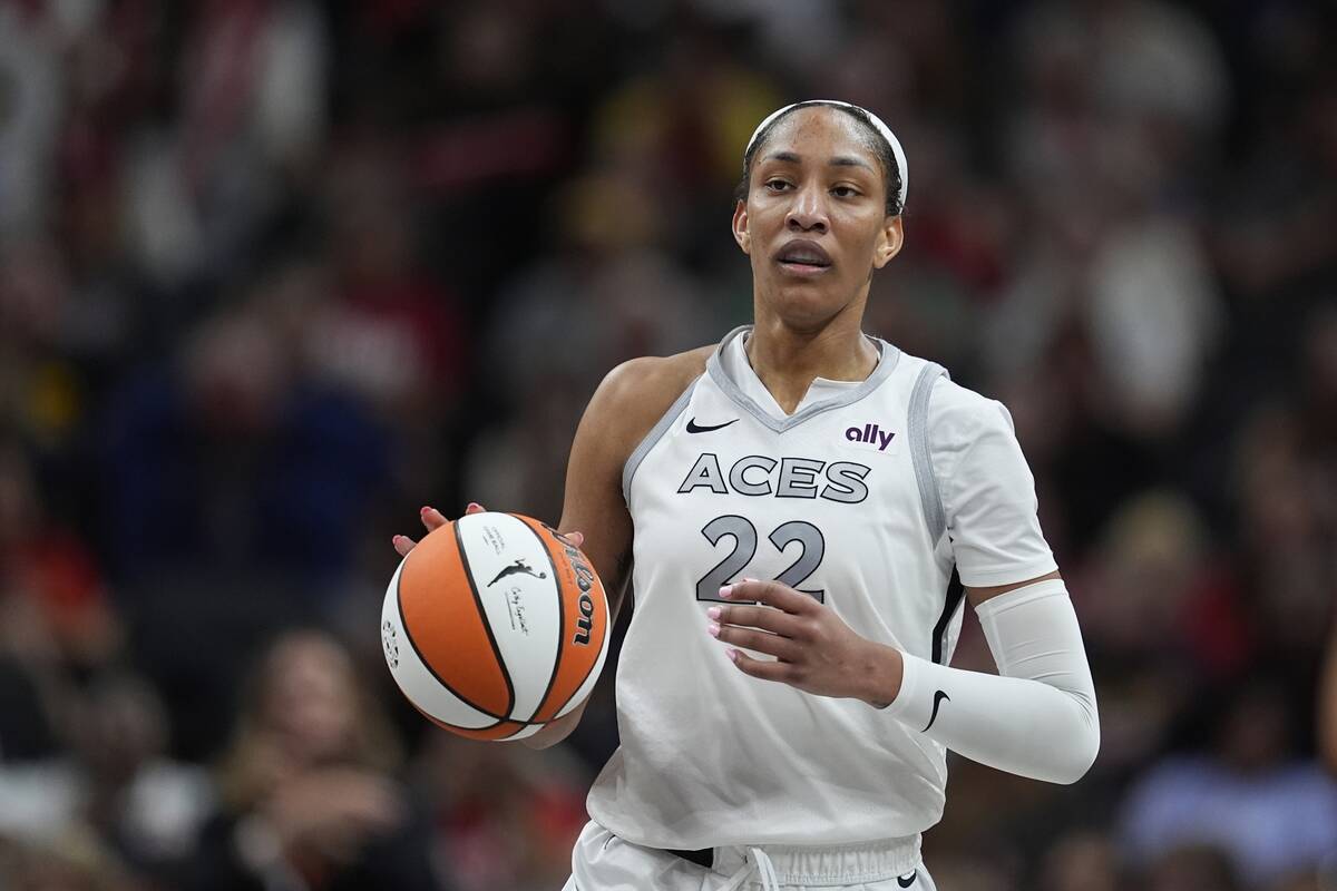 Las Vegas Aces' A'ja Wilson dribbles during the second half of a WNBA basketball game against t ...