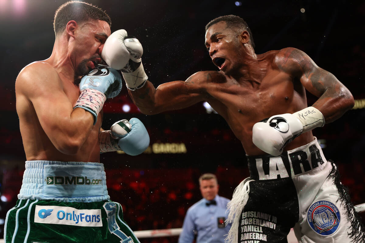 Erislandy Lara gets a hit on Danny Garcia during a middleweight championship boxing bout at T-M ...