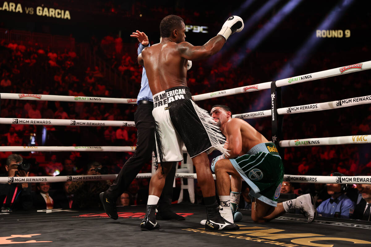 Erislandy Lara dances after knocking Danny Garcia to his knee during a middleweight championshi ...