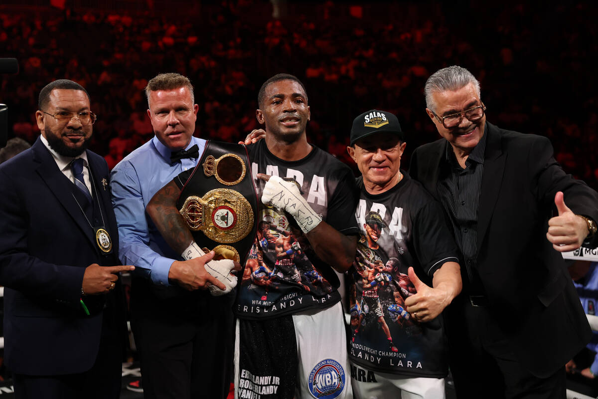 Erislandy Lara poses with his belt after winning a middleweight championship boxing bout agains ...