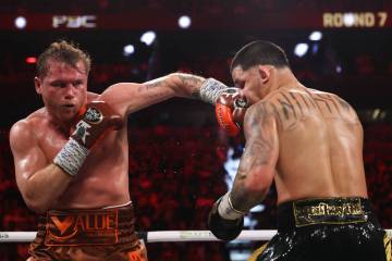 Canelo Alvarez gets a left on Edgar Berlanga during a super middleweight championship boxing bo ...