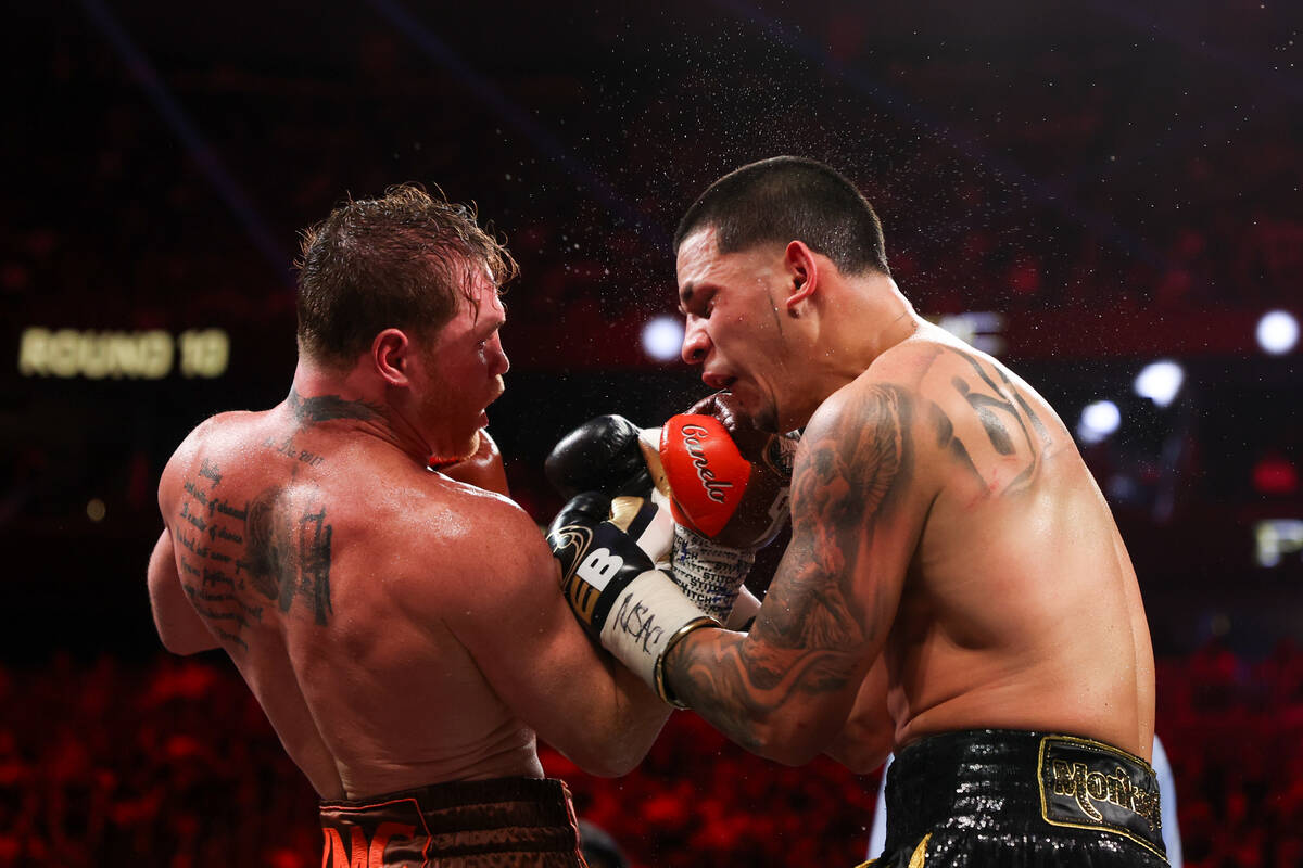 Canelo Alvarez gets an upper cut on Edgar Berlanga during a super middleweight championship box ...