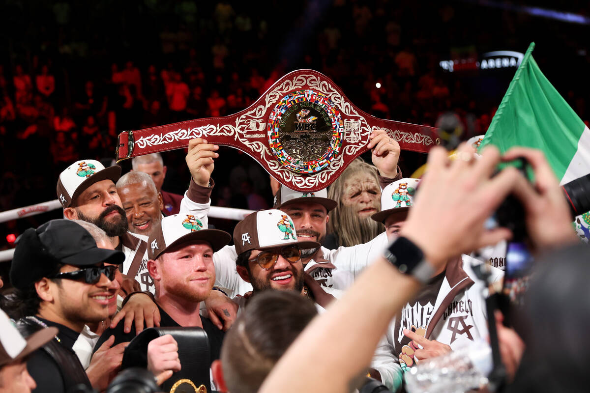 Canelo Alvarez celebrates with his team after defeating Edgar Berlanga in a super middleweight ...