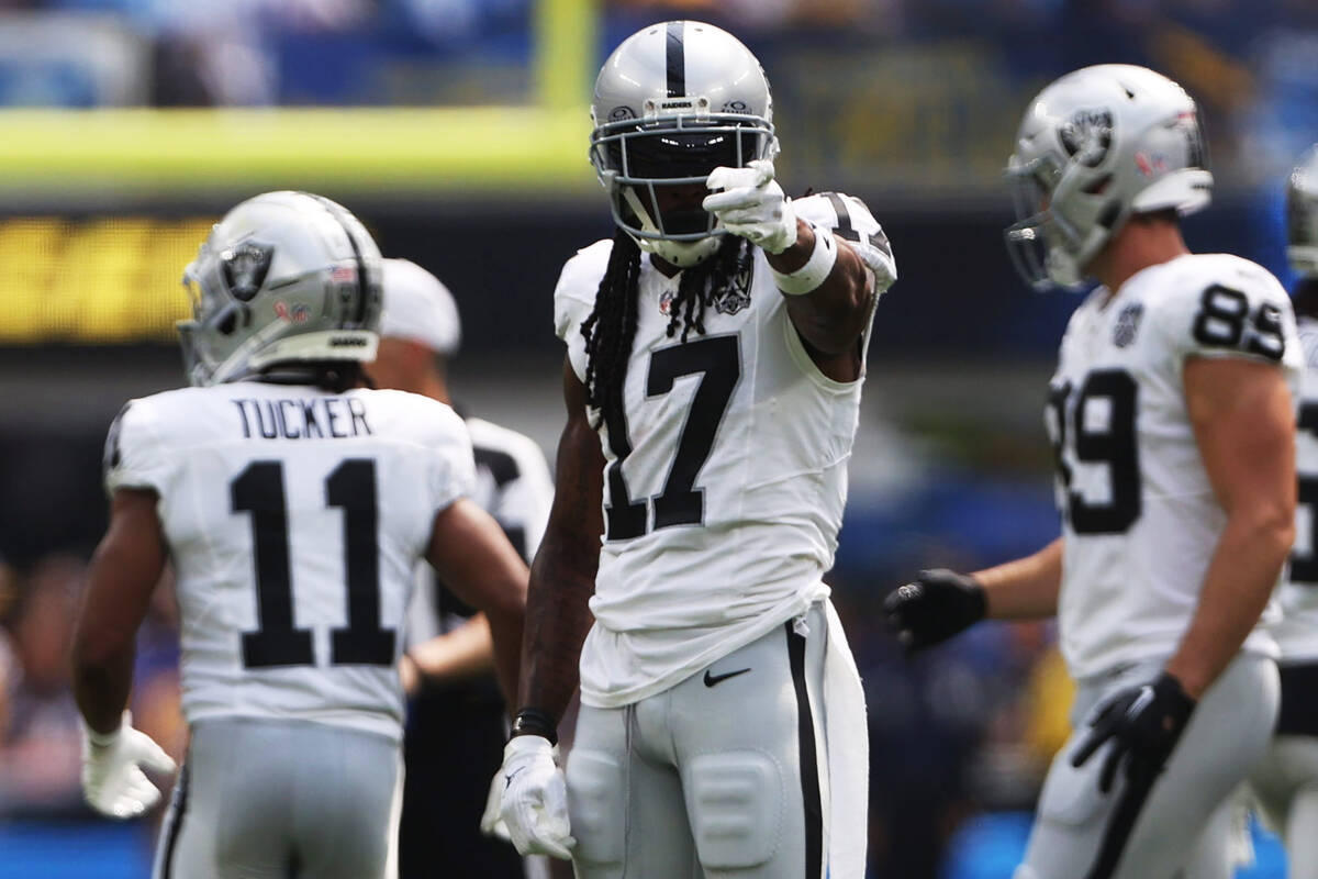 Raiders wide receiver Davante Adams (17) points after a reception during the first half of an N ...