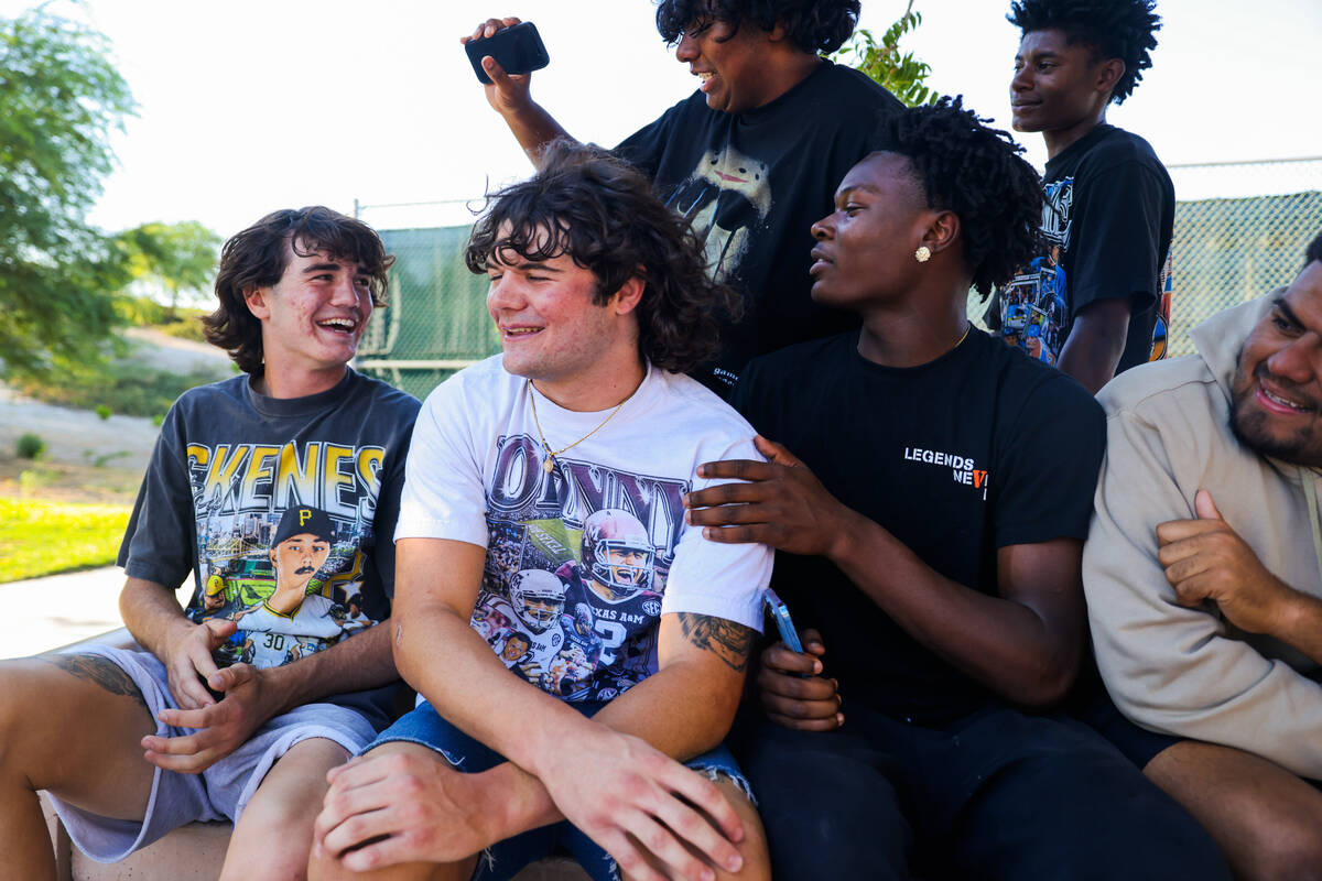 Thaddeus Thatcher, left, and his brother, Christian, second from left, hang out with friends at ...