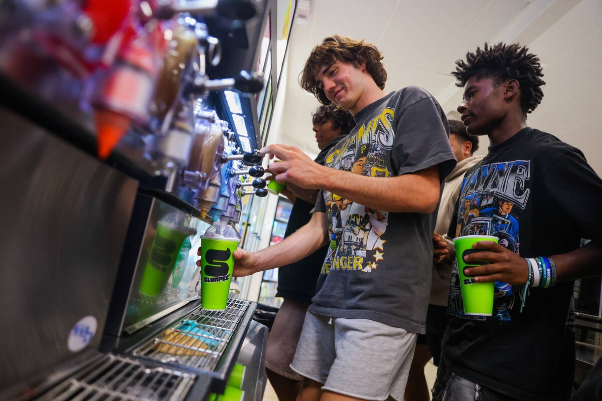 Thaddeus Thatcher gets slurpees with his friends at a 7/11 gas station on Wednesday, Sept. 11, ...