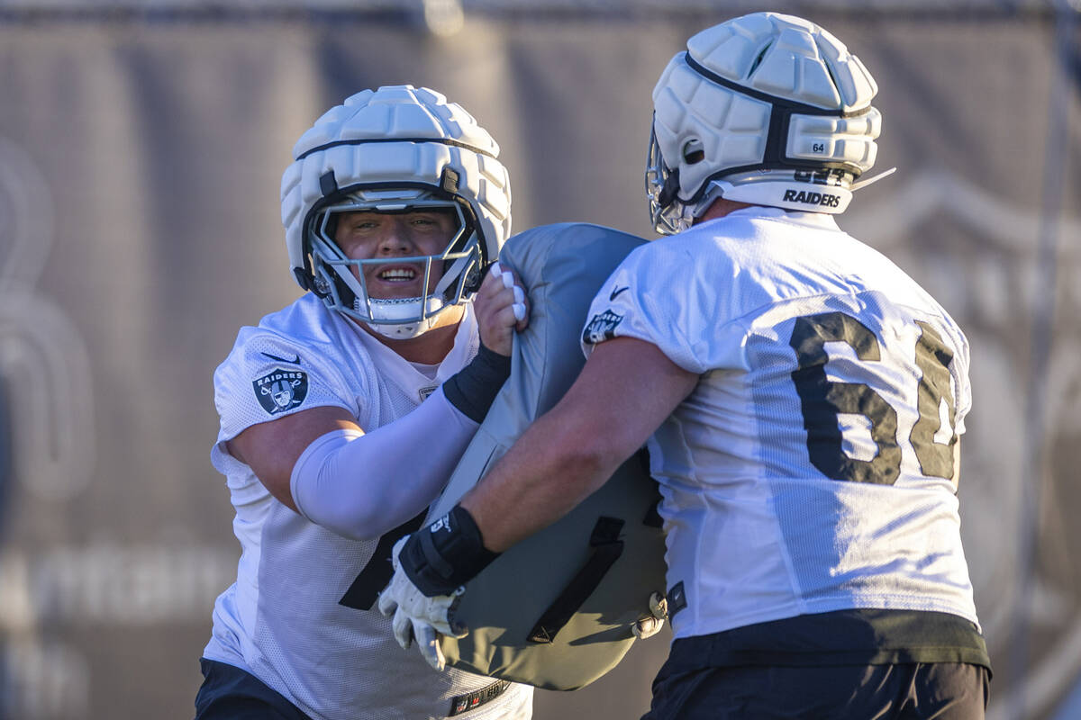 Raiders guard Jackson Powers-Johnson (70) and guard Clark Barrington (64) on a drill during pra ...