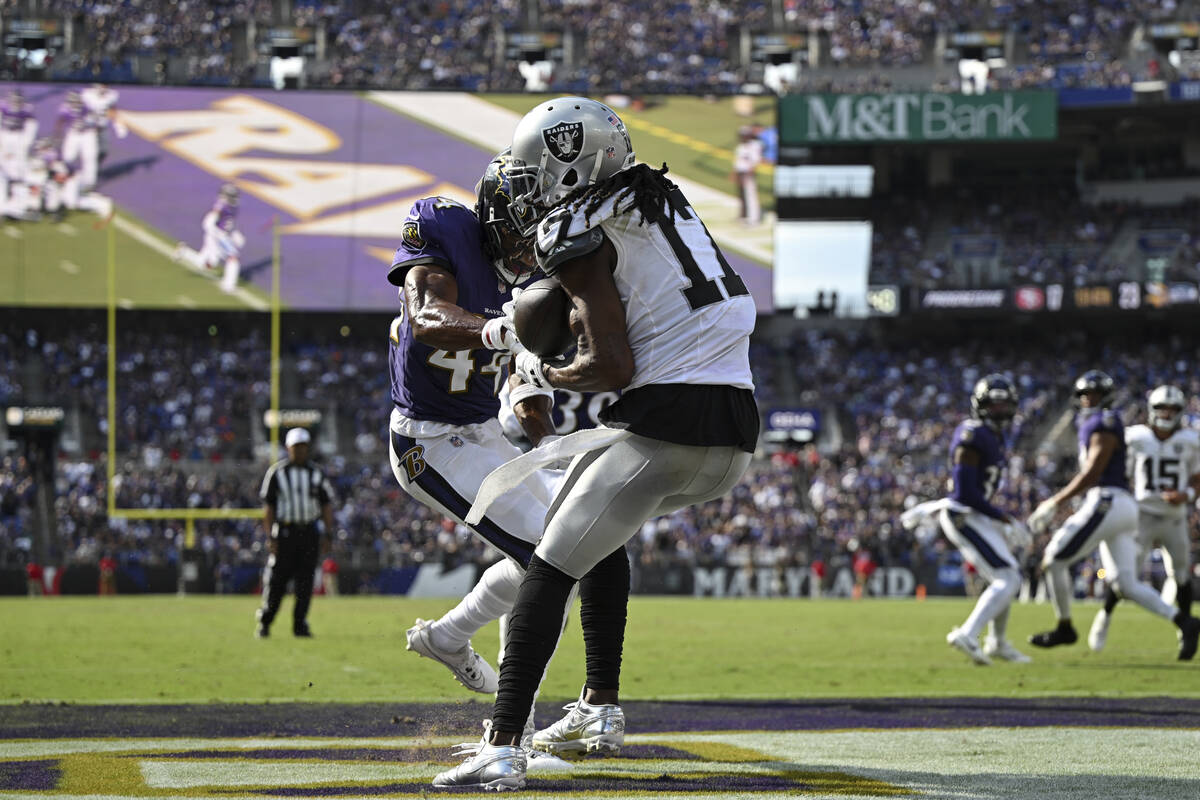 Las Vegas Raiders wide receiver Davante Adams (17) catches the ball for a touchdown against Bal ...