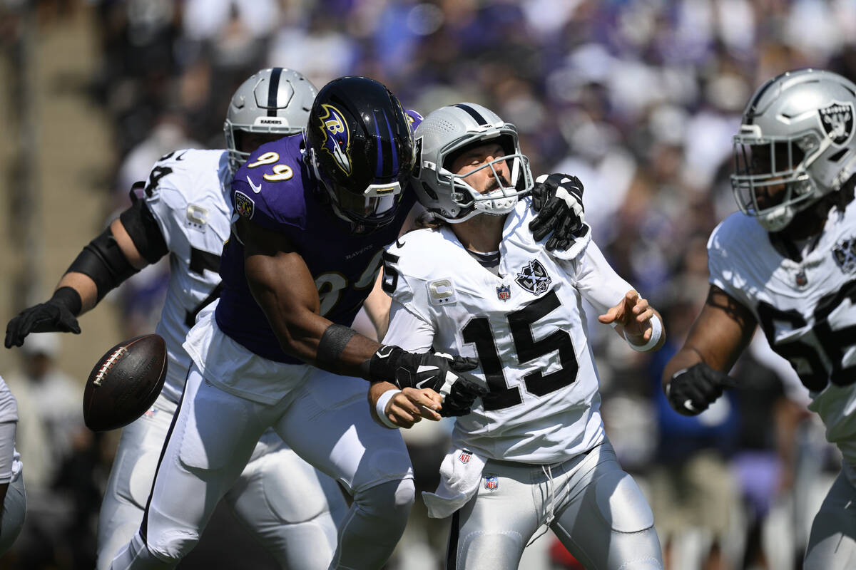 Baltimore Ravens linebacker Odafe Oweh (99) sacks Las Vegas Raiders quarterback Gardner Minshew ...