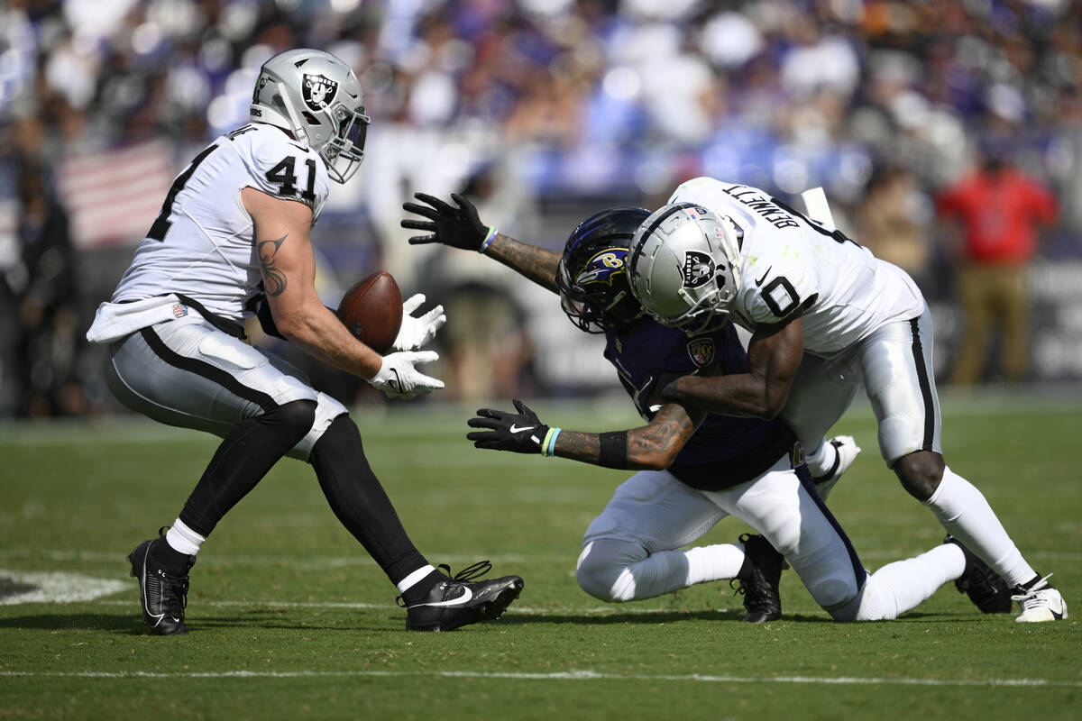 Las Vegas Raiders linebacker Robert Spillane (41) intercepts a pass intended for Baltimore Rave ...