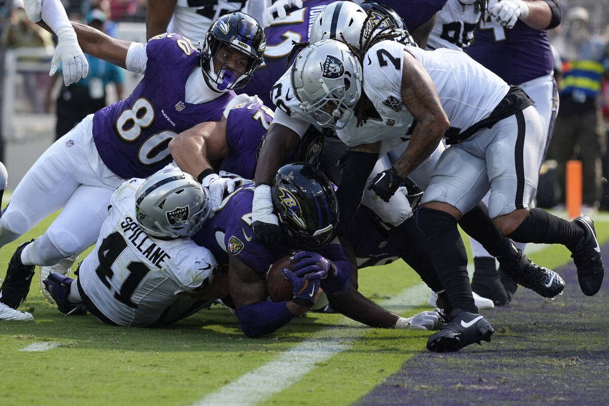 Baltimore Ravens running back Derrick Henry (22) scores a touchdown against the Las Vegas Raide ...