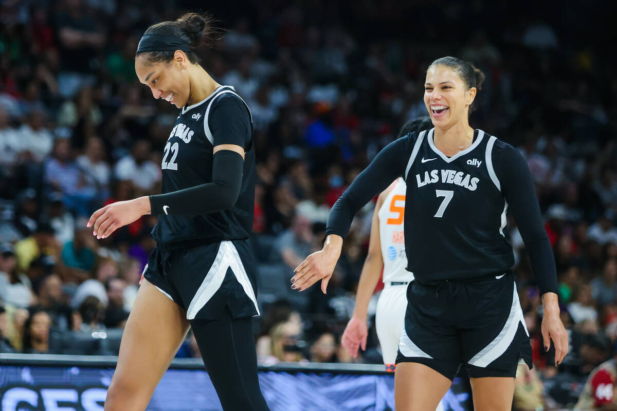 Aces center A'ja Wilson (22) and forward Alysha Clark (7) share a laugh during a time out at a ...