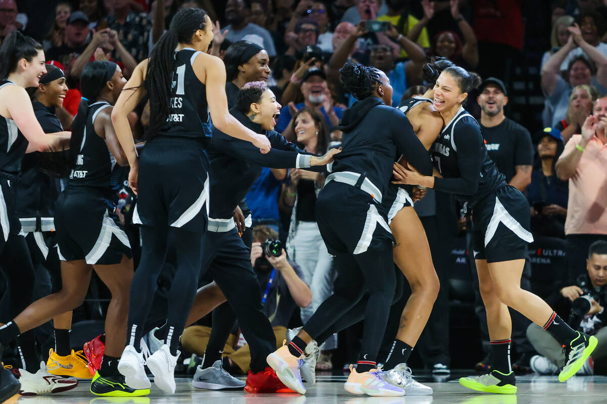 The Aces celebrate A’ja Wilson becoming the first WNBA player to score 1,000 points duri ...