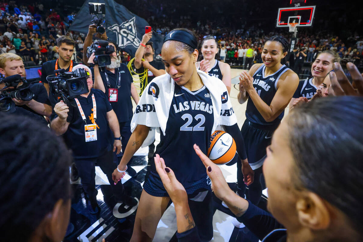 A’ja Wilson celebrates becoming the first WNBA player to score 1,000 points during a reg ...