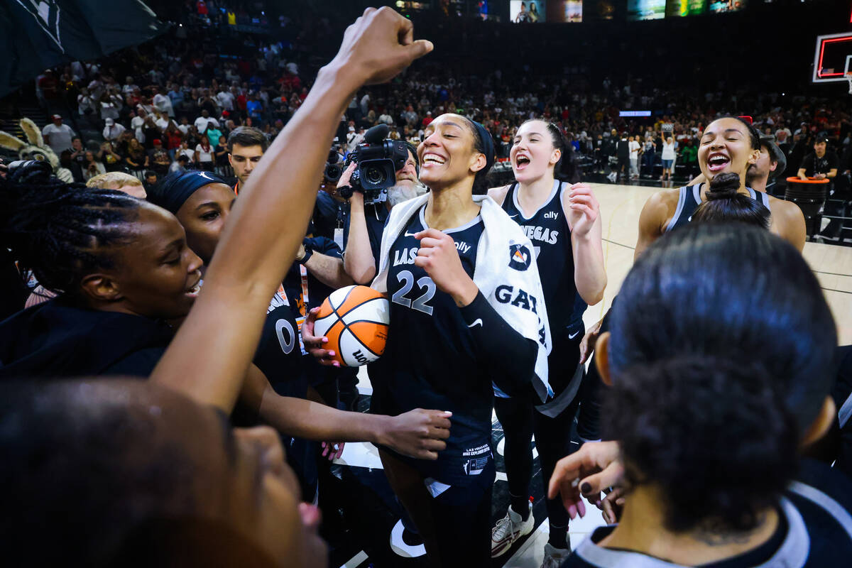 A’ja Wilson celebrates becoming the first WNBA player to score 1,000 points during a reg ...