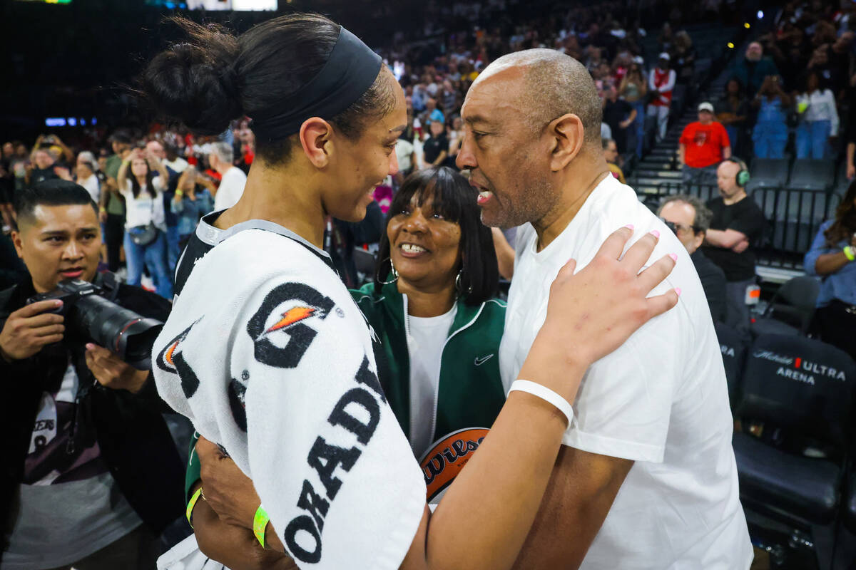 A’ja Wilson, left, embraces her parents, Eva, middle, and Roscoe after becoming the firs ...