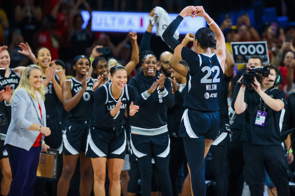 The Aces celebrate A’ja Wilson (22) becoming the first WNBA player to score 1,000 points ...