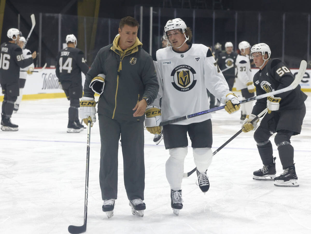 Henderson Silver Knights head coach Ryan Craig chats with forward Shane Smith (74) during first ...